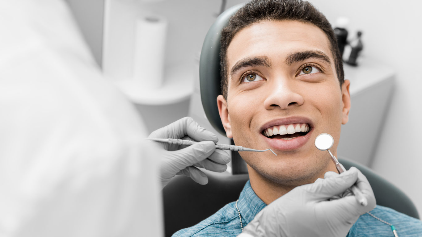 Boy Having traumatic tooth injury treatment